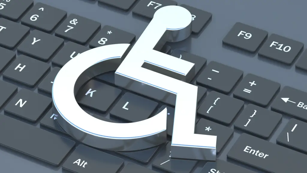 Símbolo de accesibilidad sobre el teclado de un ordenador portátil